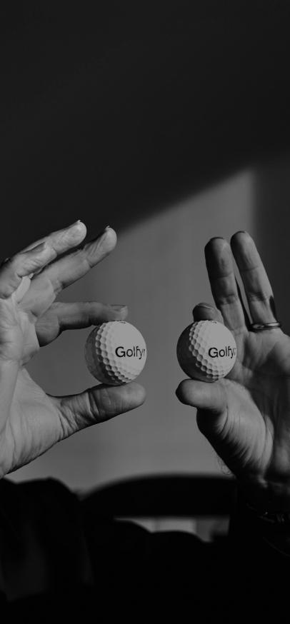 Alfredo Häberli holding two golf balls in front of him as if they were eyes